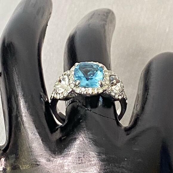 Silver Tone Cocktail Ring With Aqua Blue Central Stone And Clear Side Stones - Picture 2 of 9